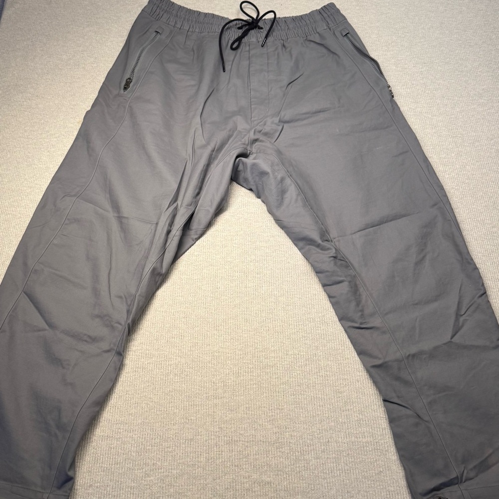 Nike ACG pants in gray, size Large. Pre owned in good condition.